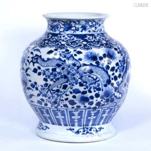 Blue and white vase Chinese, 19th Century decorated with two dragons and flowers against a dense