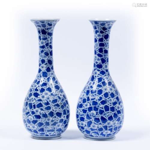 Pair of blue and white vases Chinese decorated with prunus blossom and cracked ice motif, unmarked