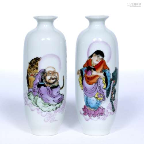 Pair of white ground cylindrical vases Chinese, Republic period depicting Guanyin and Shou-Lao