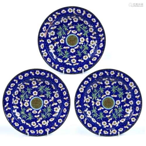Three enamel Canton plates Chinese, 19th/20th Century blue ground, decorated with a central shou