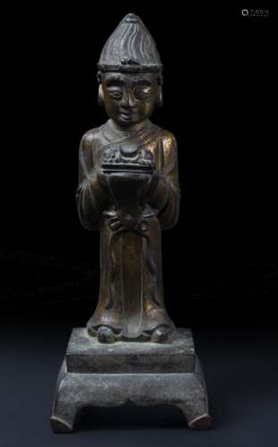 Bronze figure of a Daoist priest Chinese, late Ming standing holding a vessel containing ash and
