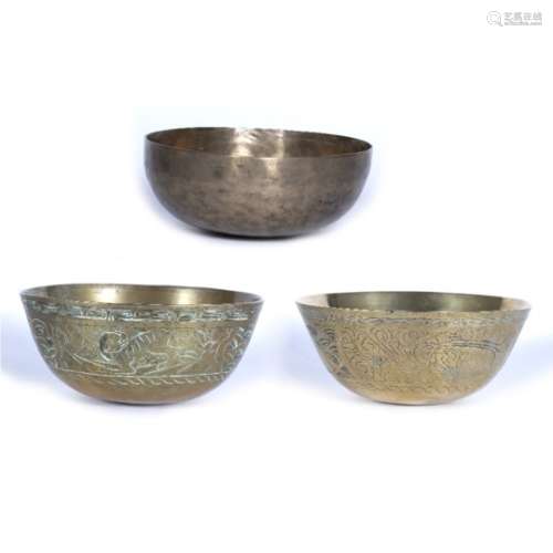 Three singing bowls Chinese and Himalayan engraved to the outside with phoenix and flowers on two