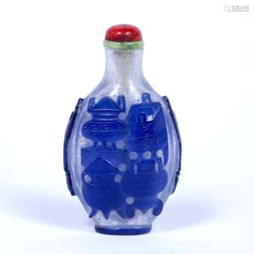 Blue glass snuff bottle Chinese, 19th Century of ovoid form, decorated with overlaid blue