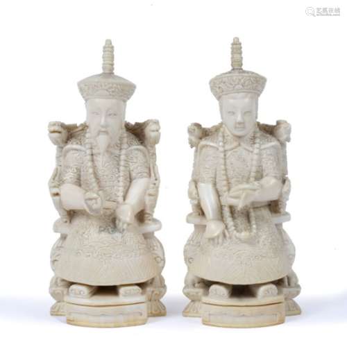 Pair of ivory Emperor and Empress Chinese, circa 1920 dressed in regalia, each holding ritual