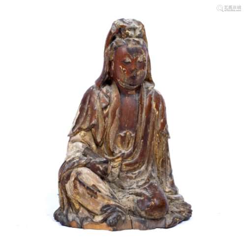 Carved wooden Guanyin Chinese, 17th Century seated with a hand resting on the lap holding an object,