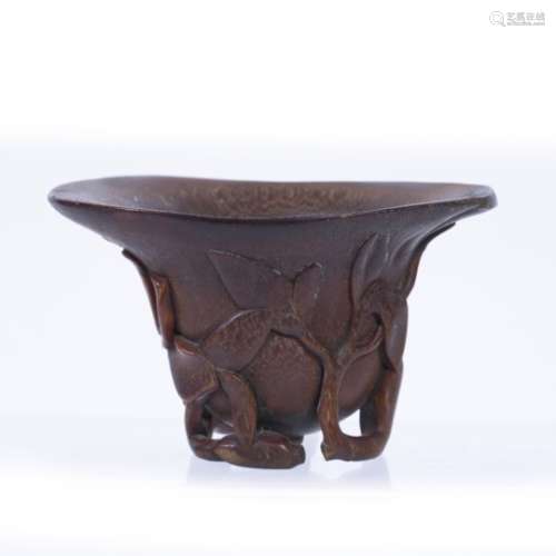 Rhinoceros horn libation cup Chinese, 18th/19th Century carved with a foliating branch forming an