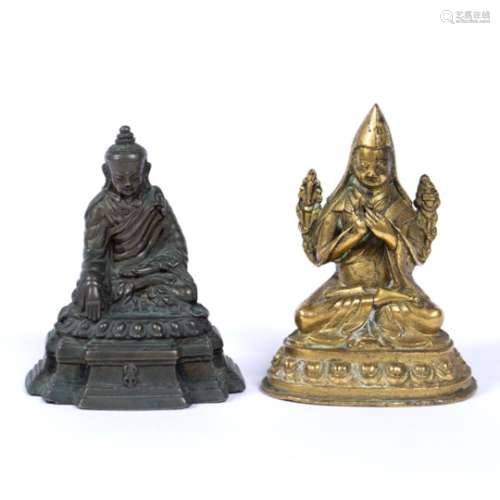 Two bronze buddhas Chinese, 18th Century the first in gilt depicting a figure cross-legged with