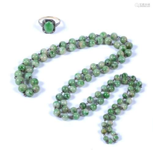 Jade bead necklace compromising a single string of graduated beads, and a jade cabochon and