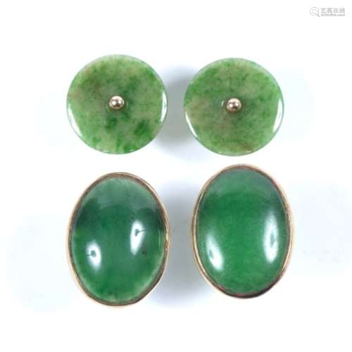 Pair of jade ear studs each disc-shaped jade panel with central bead, and a pair of green