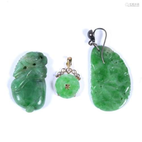 Jade pendant the circular jade panel within a scrolled mount, stamped '585', a jade earring, with