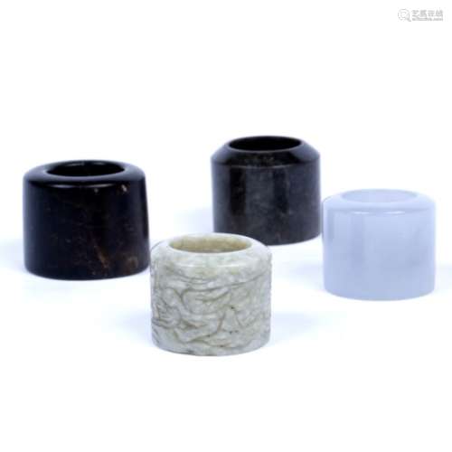 Four hard stone archer's rings Chinese, 20th Century three of plain form, one carved (4)