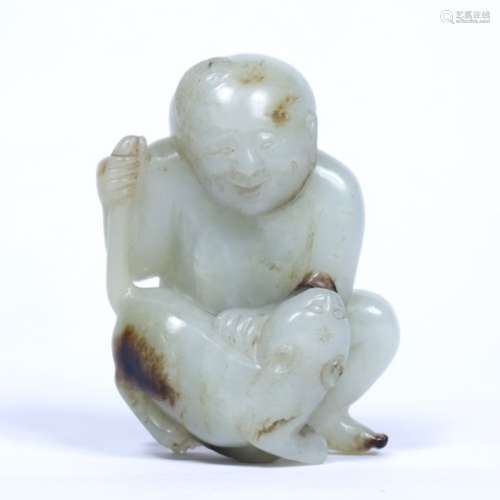 White jade pebble Chinese with brown inflection, carved as a seated youth playing with a cat 7cm