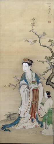 Study of Guanyin Chinese standing outside against a flowering tree with an attendant or child