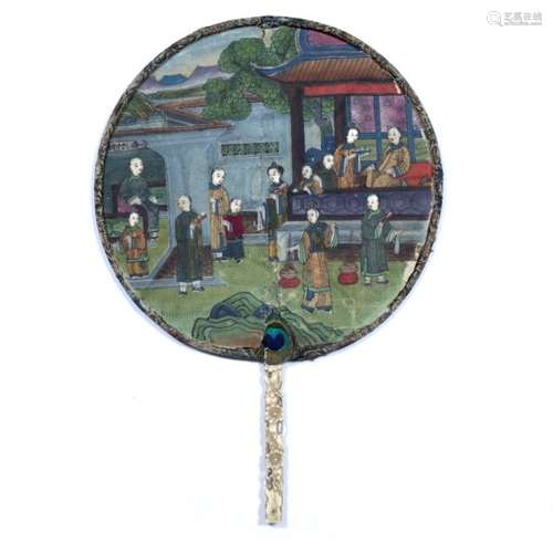 Circular fan Chinese, 19th Century of painted paper depicting a family of twelve set within the