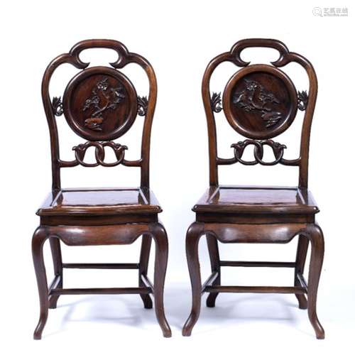 Pair of hardwood side chairs Chinese, 19th Century each with carved circular removable panels to the