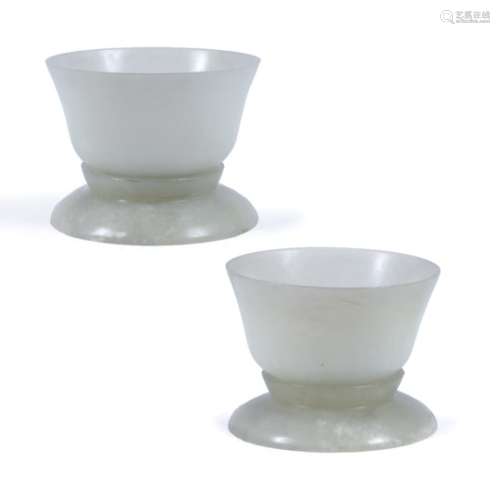 Two hard stone bowls Chinese of plain form, each with separate stands (2)