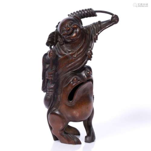 Bamboo carving of How Sien Sheng Chinese, 19th Century the smiling figure seated on a toad and