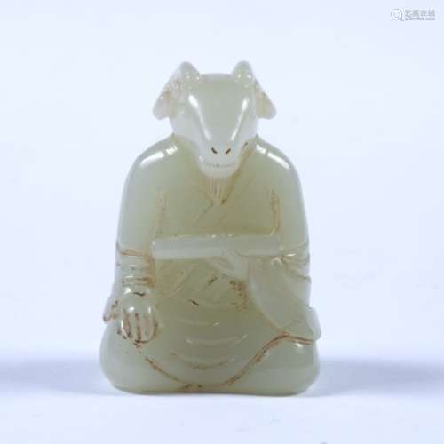 White jade pebble Chinese carved as a goat headed priest holding a scroll 4.5cm high
