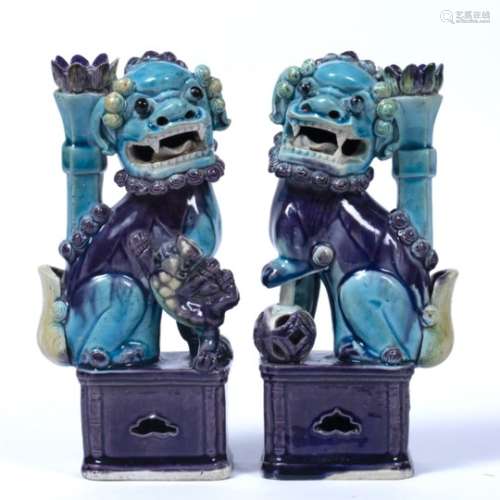 Pair of qilin taper sticks Chinese, 19th Century painted in turquoise and purple glaze 21.5cm