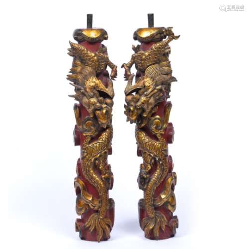 Carved and gilt wood stands Chinese, early 20th Century each with entwined dragon 45cm