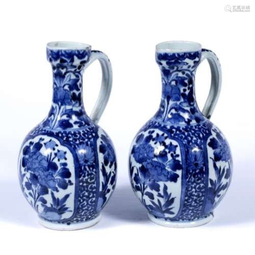 Pair of Arita blue and white ewers Japanese, late 17th Century painted globular with landscape