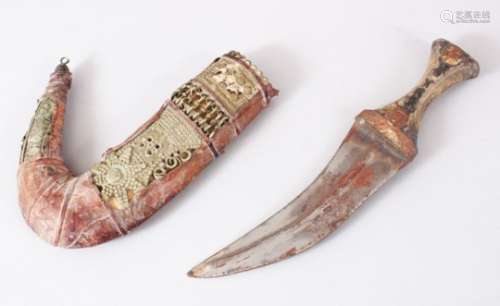 A GOOD PERSIAN JAMBYA DAGGER, the sheath formed from white metal and leather, the handle formed from