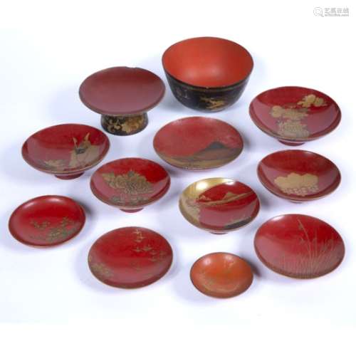 Group of red and gold lacquer saki cups and stands Japanese, Meiji including hira-miyake