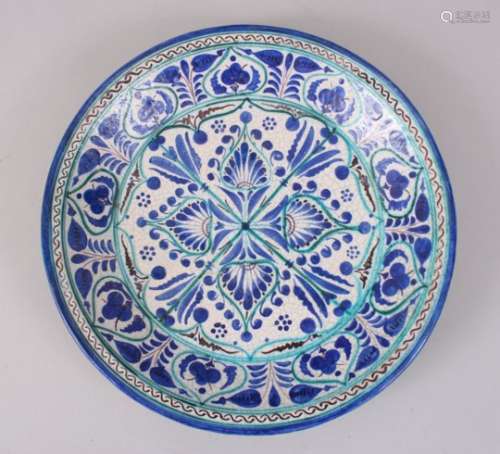 A 19TH CENTURY ASIAN BURKHARD BLUE AND WHITE CIRCULAR DISH, 32cm diameter.