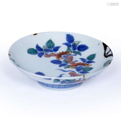 Nabeshima saucer dish Japanese, 19th Century decorated with a spreading floral and foliate motif and