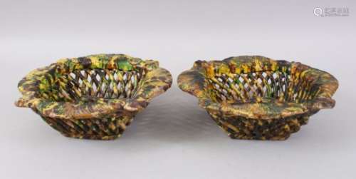 A RARE PAIR OF 19TH CENTURY TURKISH OTTOMAN CANAKKALE POTTERY PIERCED YELLOW GROUND BASKETS, 25cm