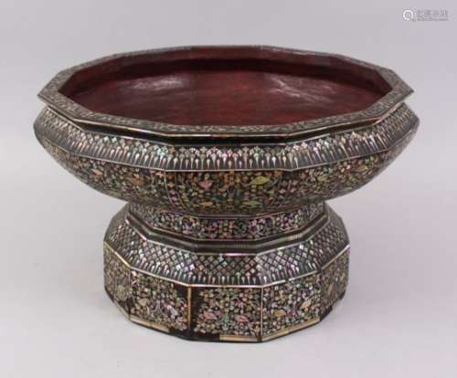A LARGE 19TH CENTURY THAI MOTHER OF PEARL INLAID LACQUERED TWELVE-SIDED PEDESTAL BOWL, 36cm diameter