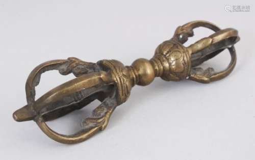 A BRASS VAJRA, TIBET, 20TH CENTURY, with segmented handle, the terminals issuing from stylised