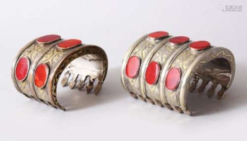 TWO GOOD 19TH / 20TH CENTURY CARNELIAN INSET SILVER & GILT TURKMEN BRACELETS, the bracelets each