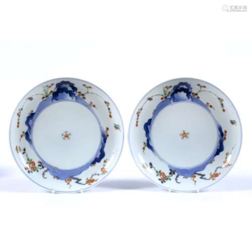 Pair of Kakiemon plates Japanese, 19th Century decorated to the front with a circular plaque with