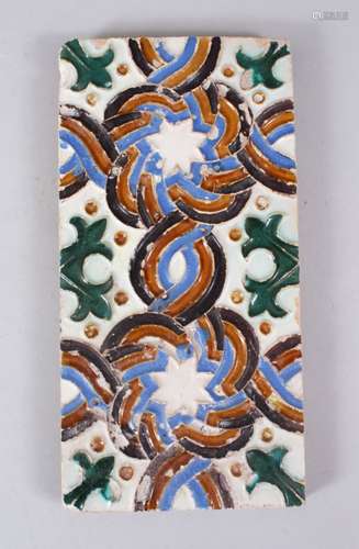 A GOOD 17TH CENTURY HISPANO MORESQUE TILE, with decoration using biscuit, blues and green, 27.5cm