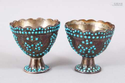 A PAIR OF 19TH CENTURY PERSIAN QUAJAR TURQUOISE SINSET SILVER CUPS, the cups with scalloped rims and