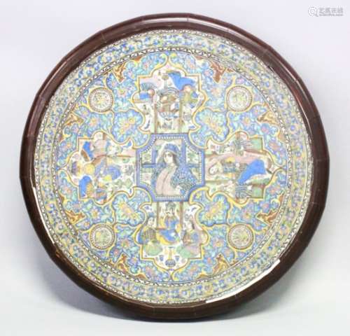 A VERY GOOD 19TH CENTURY PERSIAN QAJAR CIRCULAR TILE / TABLE, the tile depicting various scenes of