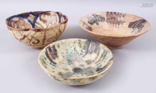 A COLLECTION OF THREE POSSIBLY EARLY ISLAMIC PERSIAN GLAZED POTTERY BOWLS, 23.5CM, 20CM & 18.3CM. (