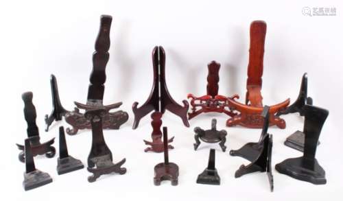 A MIXED LOT OF 15 19TH / 20TH CENTURY CHINESE CARVED AND PIERCED HARDWOOD STANDS, (15)
