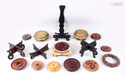 A MIXED LOT OF 15 19TH / 20TH CENTURY CHINESE CARVED AND PIERCED HARDWOOD STANDS, various styles,