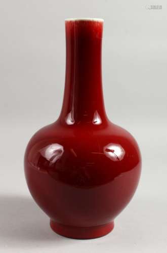 A 19TH CENTURY CHINESE SANG DE BOEUF BOTTLE VASE. 13ins high.