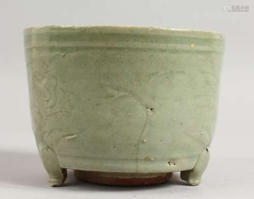 AN EARLY CHINESE LONGQUAN CELADON CIRCULAR CELADON CENSER on three legs. 5.5ins diameter.