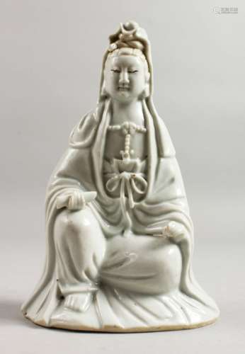 A 19TH CENTURY CHINESE BLANC DE CHINE FIGURE OF GUANYIN seated cross legged. 7.5ins high.