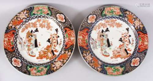 A GOOD PAIR OF JAPANESE MEIJI PERIOD IMARI PORCELAIN CHARGERS, decorated with scenes of girls in