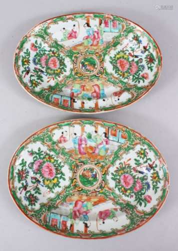 A PAIR OF 19TH CENTURY CHINESE CANTON FAMILLE ROSE OVAL PORCELAIN DISHES, both decorated with panels