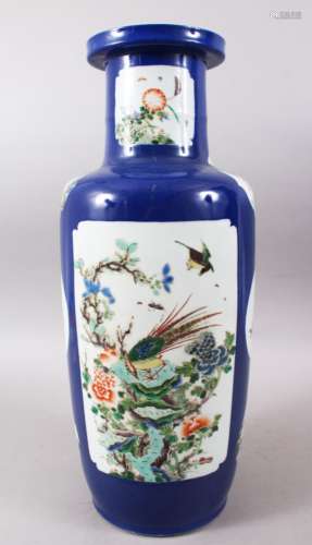 A GOOD 19TH KANGXI STYLE PORCELAIN ROULEAU VASE, with panels upon a powder blue ground depicting
