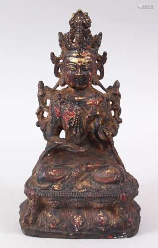 A GOOD EARLY CHINESE BRONZE BUDDHA / DEITY, in a seated position on a lotus base, holding a fruit or