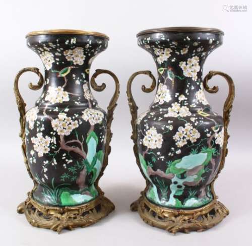 A GOOD PAIR OF 19TH CENTURY CHINESE FAMILLE NOIR ORMOLO MOUNTED VASES, the vases decorated upon a