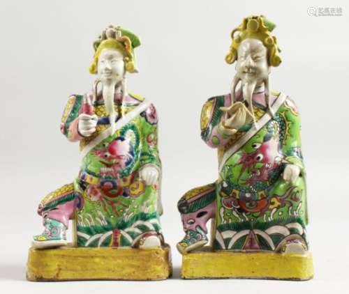 A GOOD PAIR OF 18TH CENTURY CHINESE FAMILLE ROSE FIGURES of seated Gods. 9ins high.