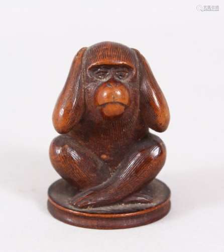 A GOOD JAPANESE LATE MEIJI PERIOD CARVED WOOD OKIMONO OF A MONKEY, with its hand over its ears, 4.